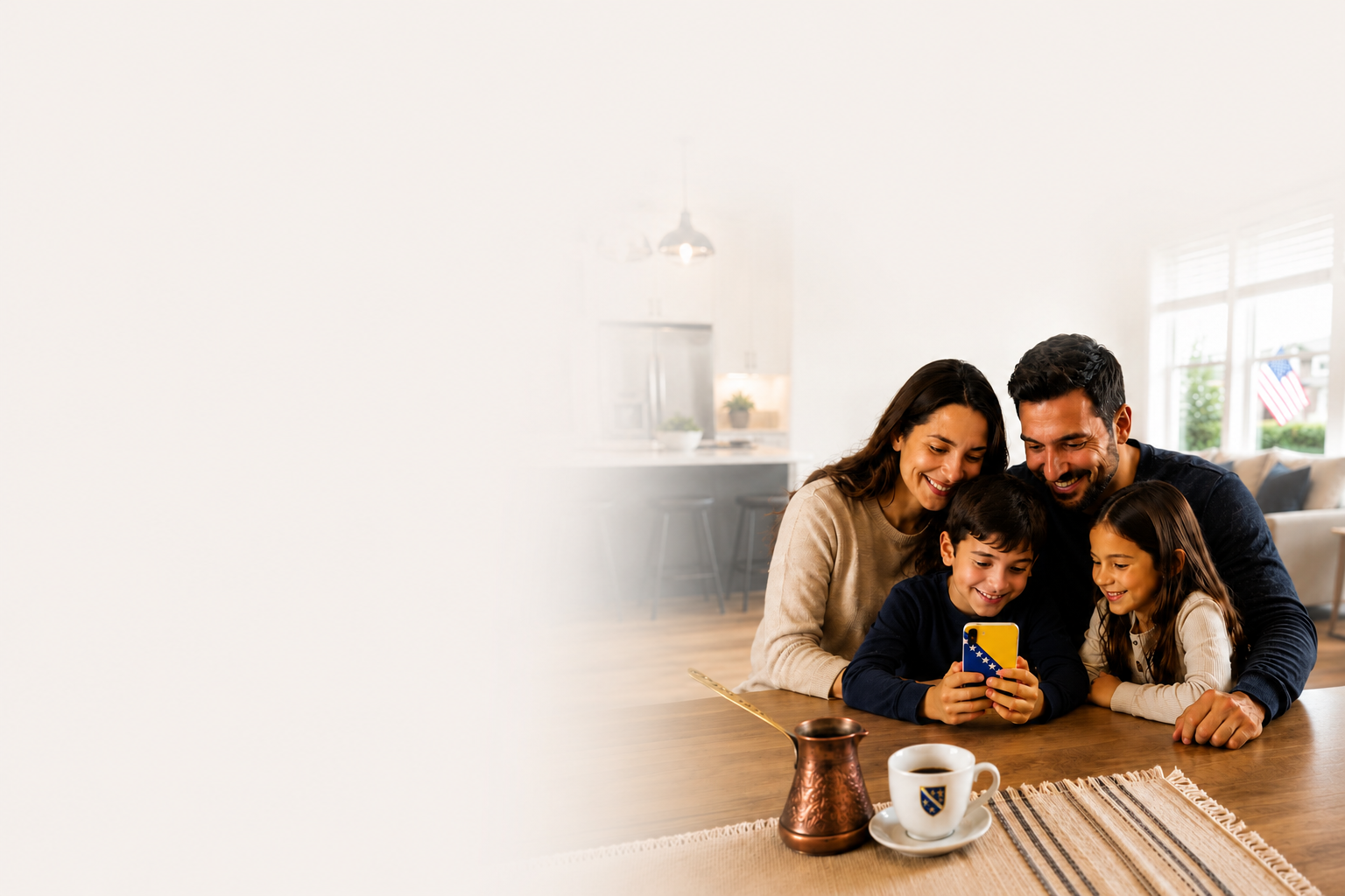 A smiling Bosnian family gathered around a phone at a kitchen table with a copper džezva and Bosnian coffee cup nearby